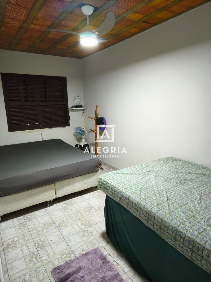 Casa térrea com estrutura para sobrado 3 dormitórios a 2 quadras da praia em Guaratuba